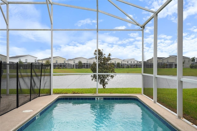 8942 Cabot Cliffs Dr, Davenport, FL 33896 - swimming pool featuring glass enclosure and a residential view