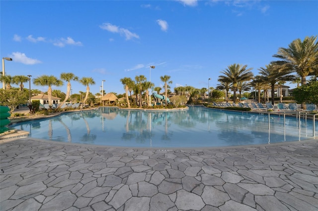 8942 Cabot Cliffs Dr, Davenport, FL 33896 - community pool with a patio area