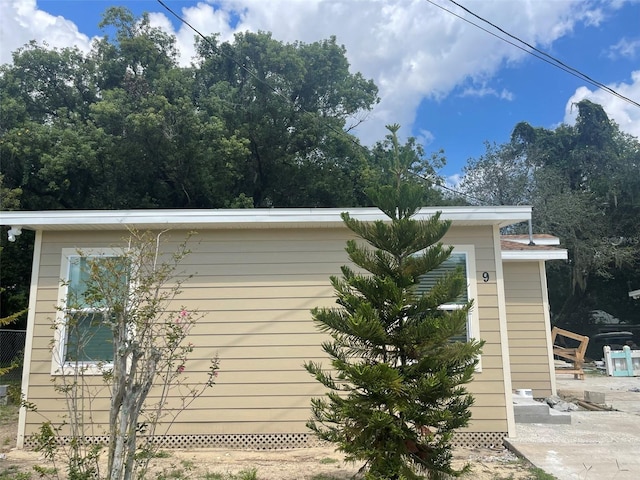 view of side of home featuring a patio area