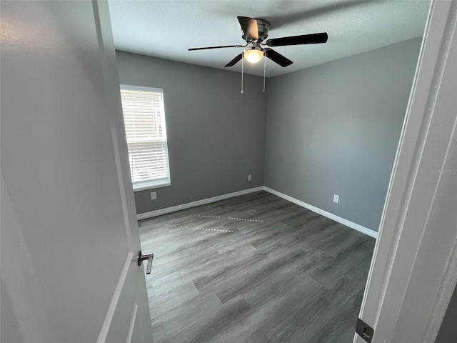 unfurnished room with hardwood / wood-style flooring and ceiling fan