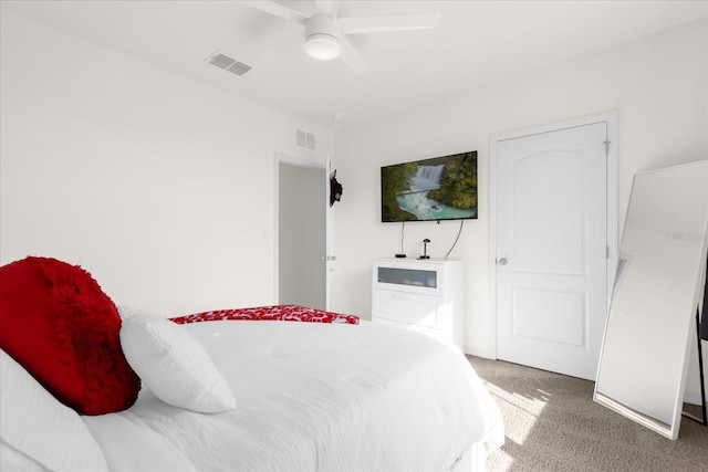 bedroom with carpet, visible vents, and a ceiling fan