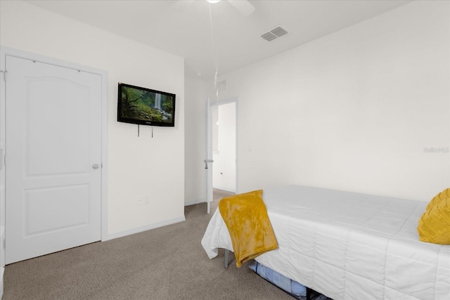 carpeted bedroom with visible vents, ceiling fan, and baseboards