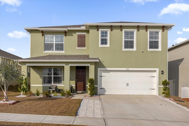 traditional home with a garage, driveway, a shingled roof, and stucco siding