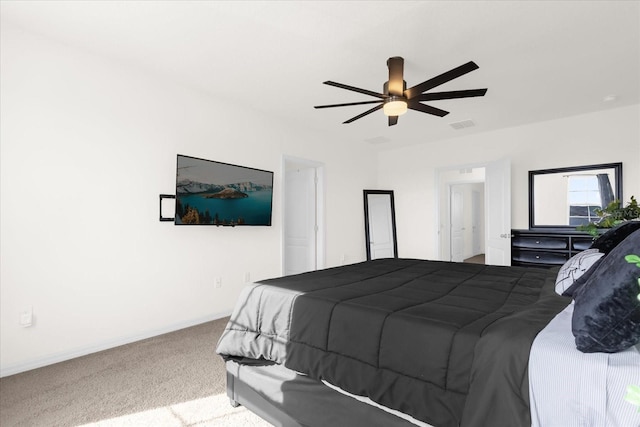 bedroom featuring light carpet, baseboards, visible vents, and a ceiling fan