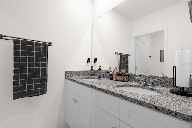 full bath featuring double vanity and a sink