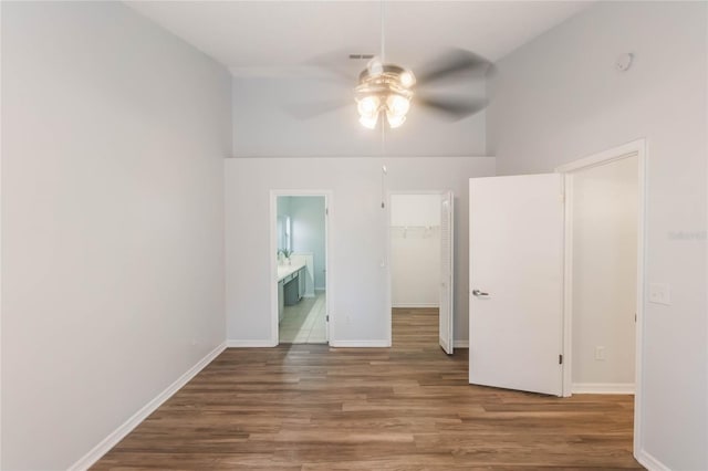 spare room featuring ceiling fan and dark wood-type flooring