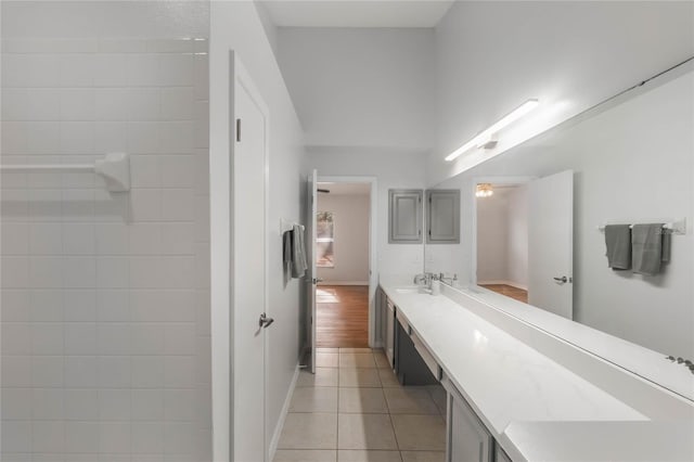 bathroom with tile patterned floors and vanity