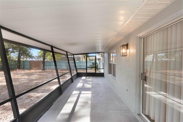 unfurnished sunroom with plenty of natural light