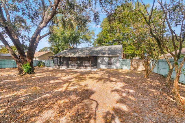 back of property featuring a sunroom