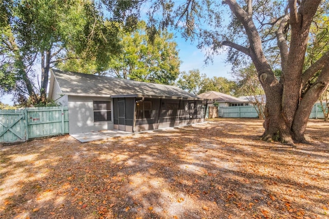 rear view of house with a sunroom