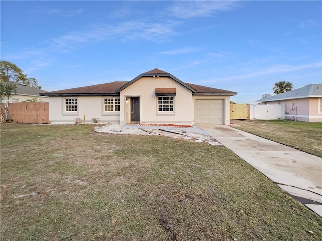 ranch-style home with a garage and a front yard