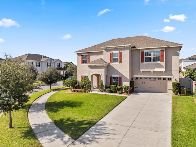 view of front of home featuring a front yard and a garage