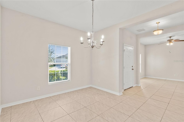 tiled empty room with ceiling fan with notable chandelier