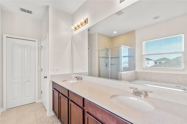 bathroom featuring tile patterned flooring, vanity, and independent shower and bath