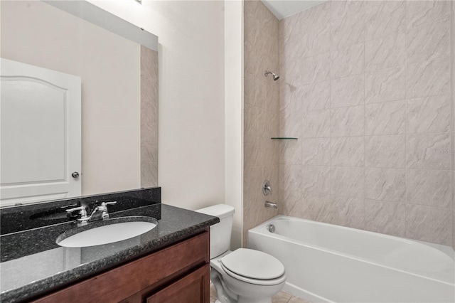 full bathroom with vanity, toilet, and tiled shower / bath