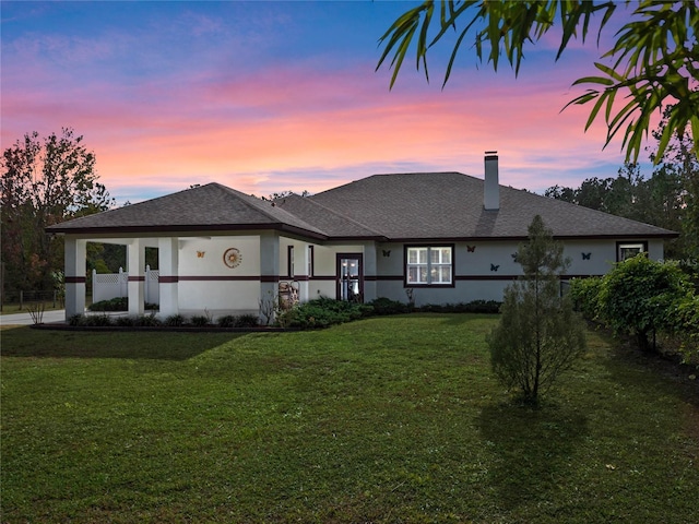 view of front of house featuring a lawn