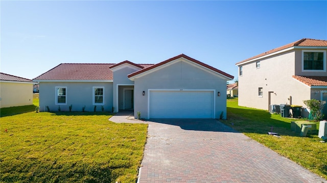 mediterranean / spanish home with central AC unit, a garage, and a front lawn