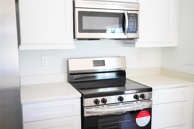 kitchen with white cabinets and stainless steel appliances