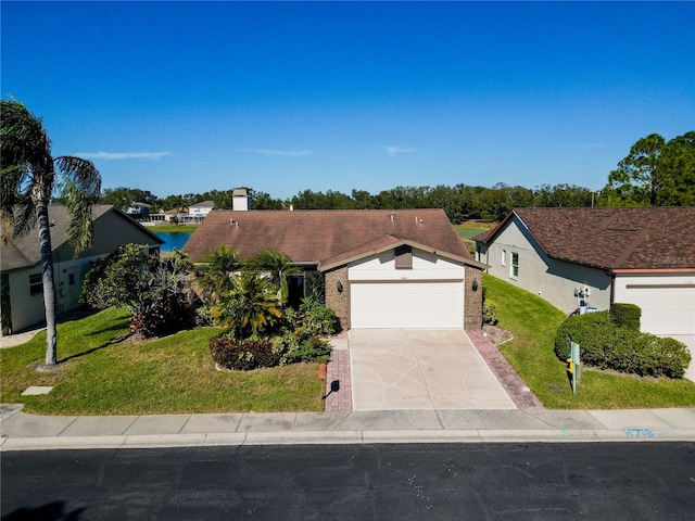 single story home with a garage and a front lawn