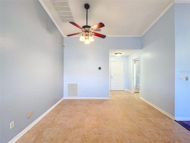 spare room featuring light tile patterned floors, ceiling fan, and crown molding