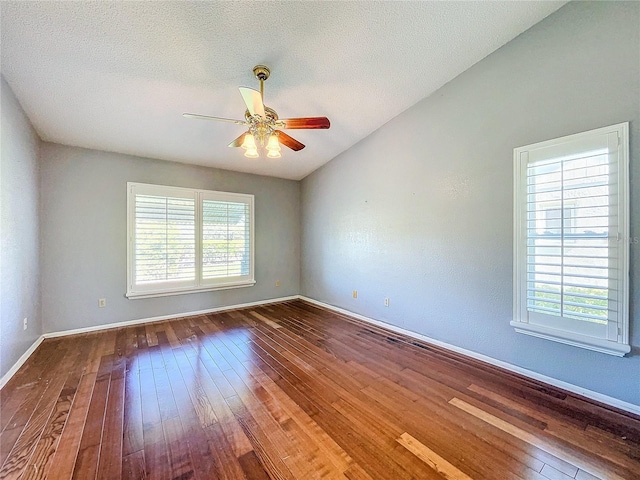 spare room with ceiling fan, a textured ceiling, and hardwood / wood-style flooring