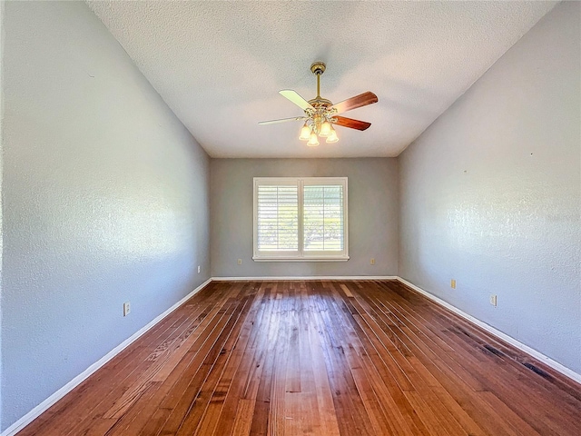 unfurnished room featuring hardwood / wood-style floors, ceiling fan, and a textured ceiling