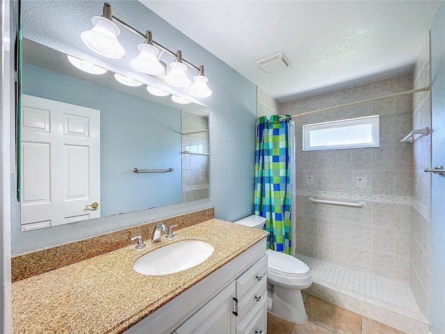 bathroom featuring vanity, tile patterned floors, toilet, a textured ceiling, and curtained shower