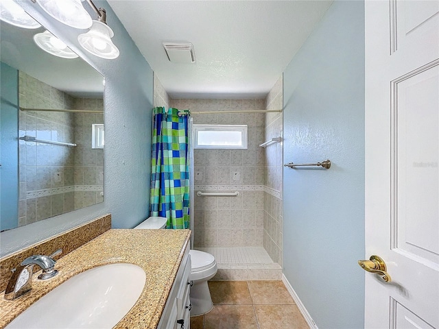 bathroom featuring walk in shower, tile patterned flooring, a textured ceiling, toilet, and vanity