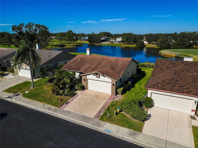 drone / aerial view featuring a water view