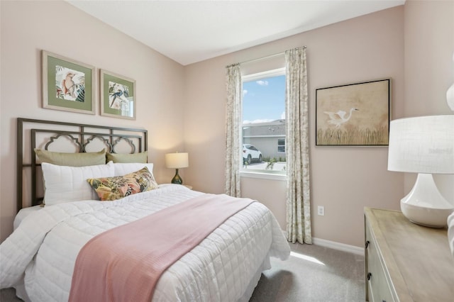 bedroom with light colored carpet