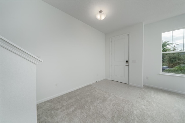 empty room with light colored carpet