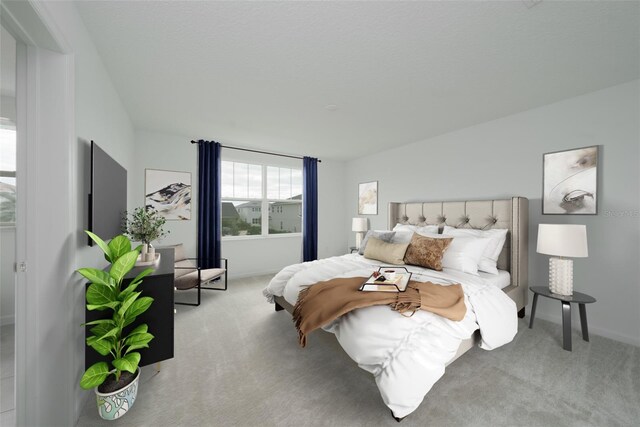 bedroom with light colored carpet