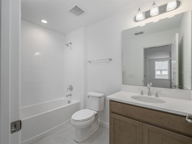 full bathroom featuring tile patterned flooring, vanity, tiled shower / bath combo, and toilet