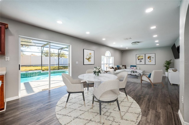 dining area with dark hardwood / wood-style floors