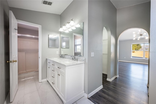 bathroom featuring hardwood / wood-style floors and vanity