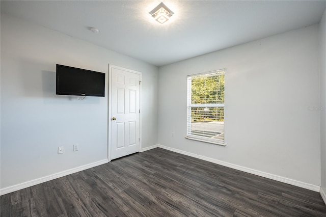 empty room featuring dark hardwood / wood-style floors