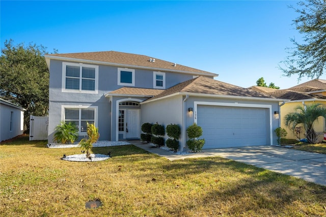 view of front of house with a garage and a front lawn