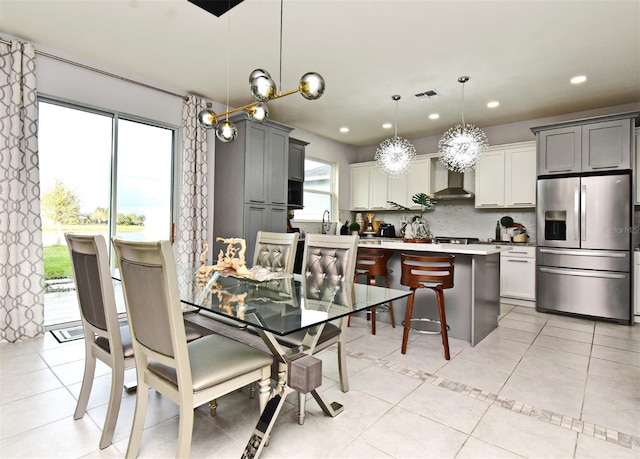 tiled dining area featuring sink