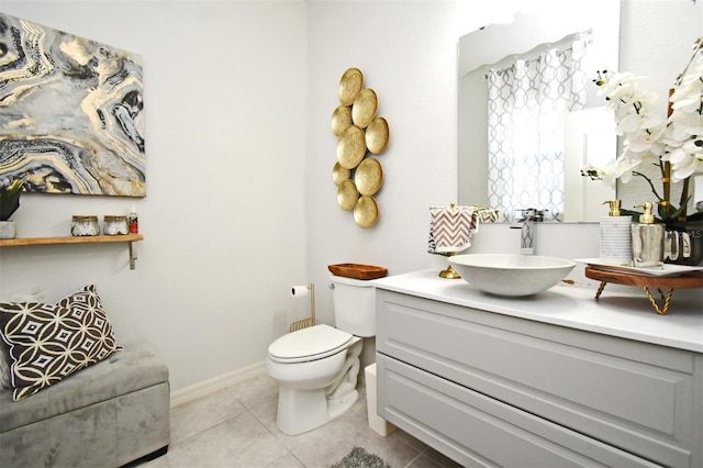 bathroom featuring tile patterned floors, vanity, and toilet