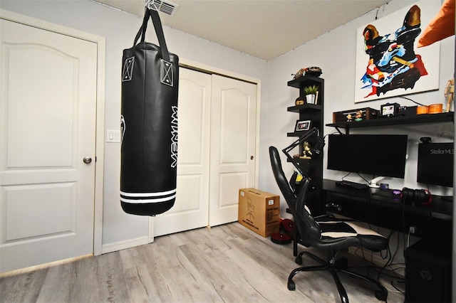 home office featuring light hardwood / wood-style floors