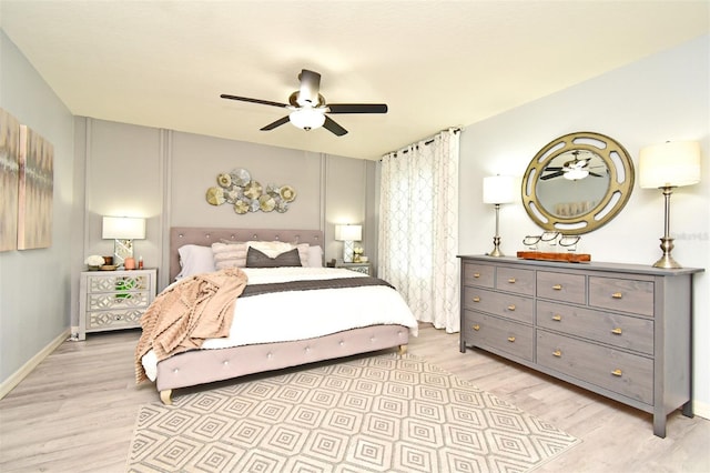 bedroom with ceiling fan and light hardwood / wood-style floors