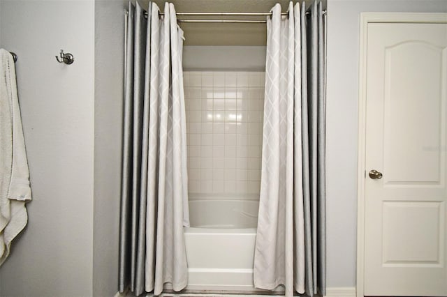 bathroom featuring shower / tub combo with curtain