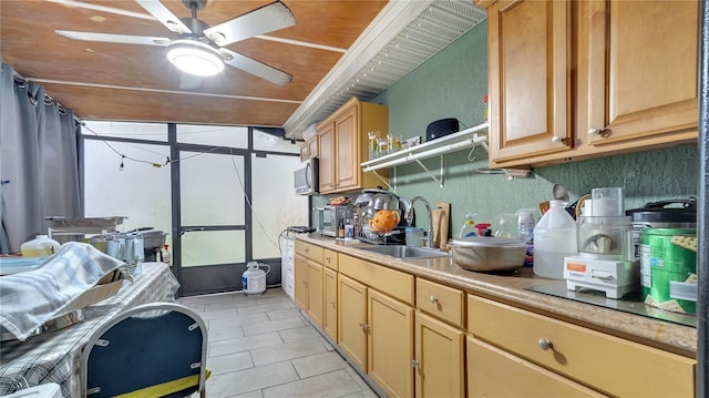 kitchen featuring sink, light tile patterned flooring, wooden ceiling, and ceiling fan