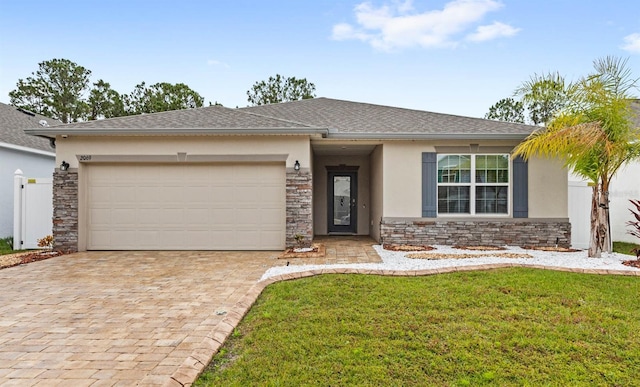 view of front facade featuring stone siding, stucco siding, an attached garage, decorative driveway, and a front yard