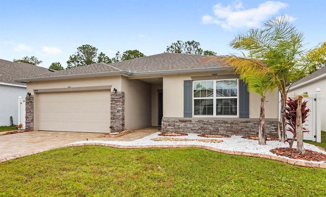 view of front of home featuring a front yard and a garage