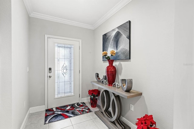 tiled entryway featuring baseboards and ornamental molding