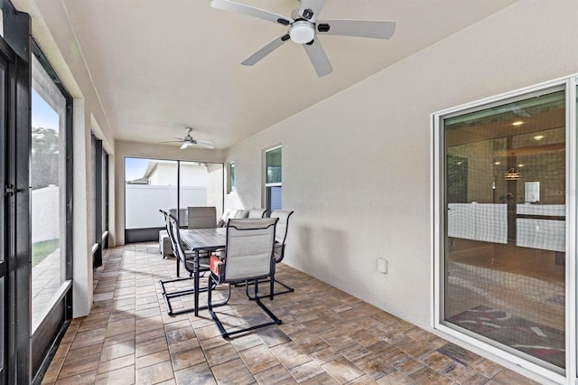 sunroom with ceiling fan