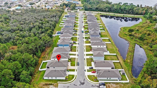 aerial view with a water view and a residential view