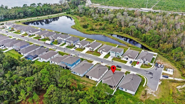 aerial view with a residential view and a water view