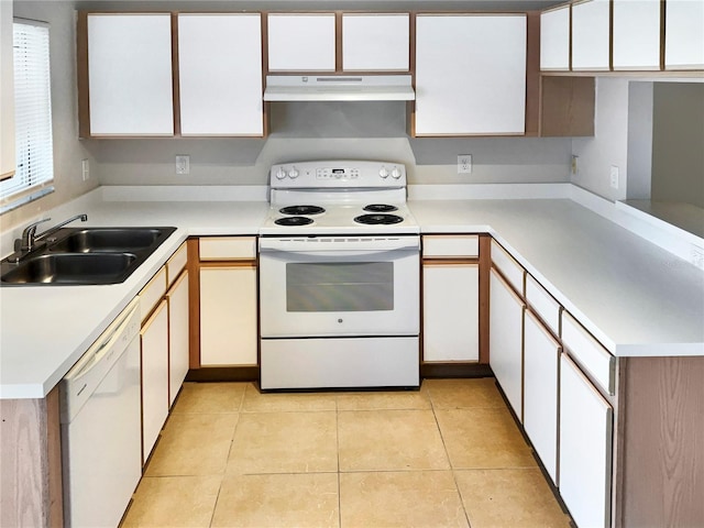 kitchen featuring white cabinets, light tile patterned floors, white appliances, and sink